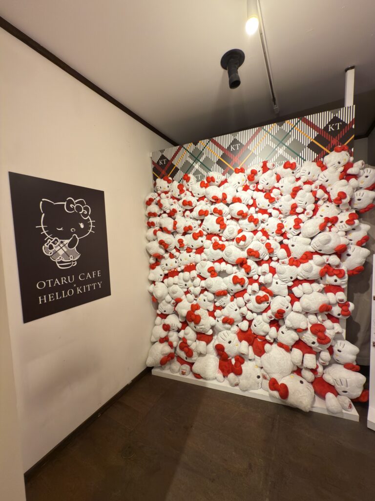 Photo wall of Hello Kitty plushies at Otaru Hello Kitty Café, popular Instagram photo spot and unique attraction in Otaru Hokkaido