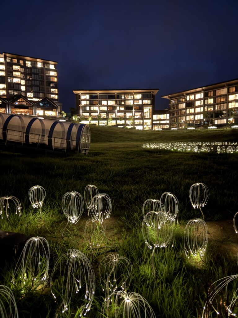 Night view of Hotel Nikko Style Niseko HANAZONO luxury resort with Mountain Lights illumination art installation in free zone — top Niseko Hokkaido hotel stay 2025