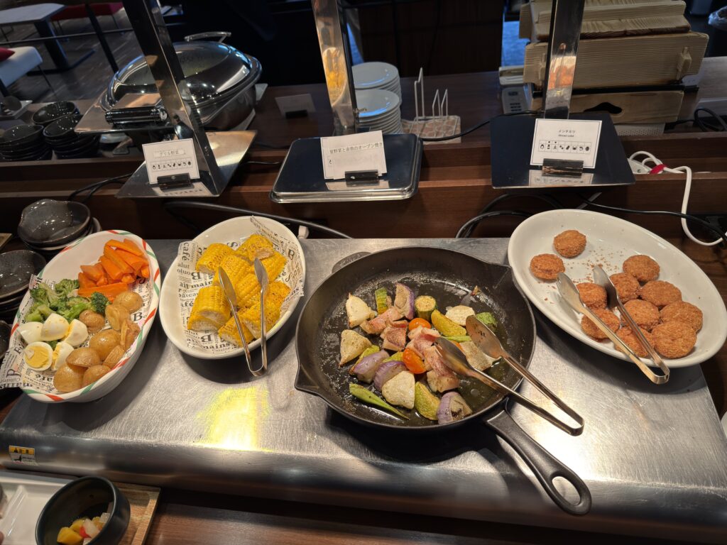 nterior of Torifito Hotel & Pod Niseko with modern lounge, Northern Kitchen restaurant, and breakfast buffet in central Kutchan
