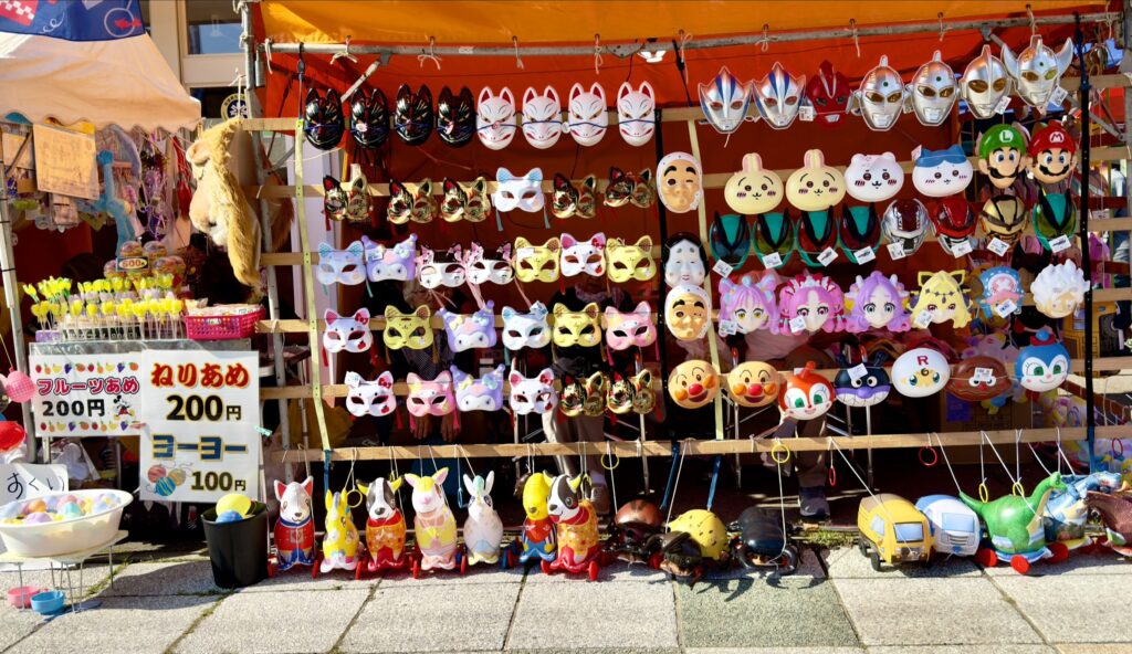 Kutchan Potato Festival 2026 festival game stalls with masks and yo-yo balloons